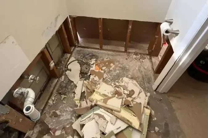 Bathroom stripped to the studs after a sewage backup cleanup