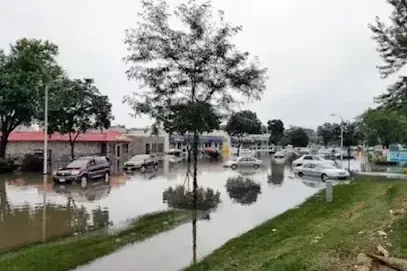 Flood water over a lot and lawn, the kind Clearwater storms bring